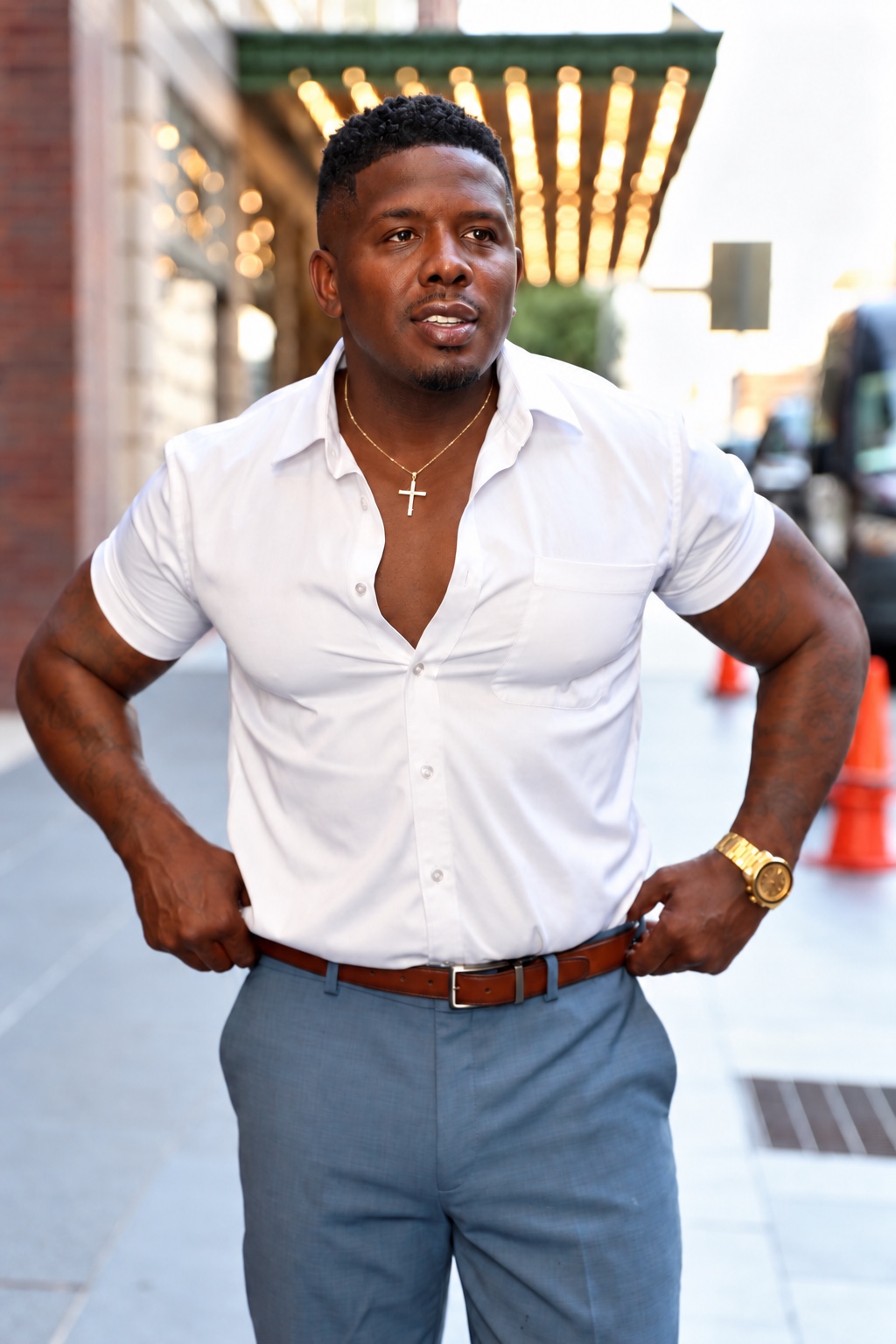 Montreal Diggs outdoors wearing a white shirt and gray trousers